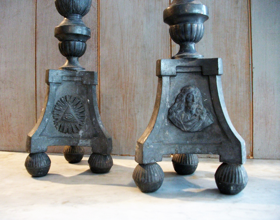 a pair of pewter candlesticks